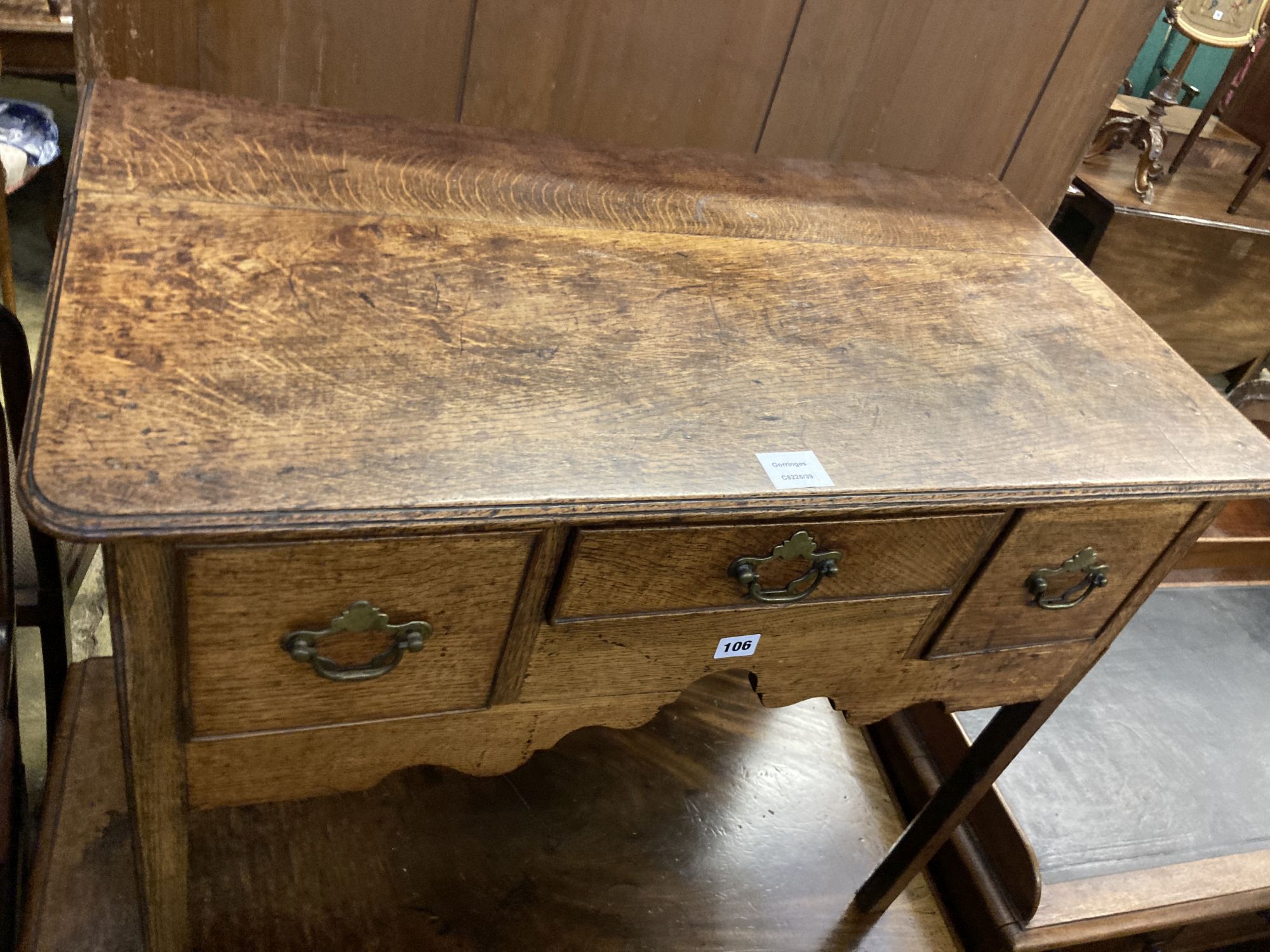 A George III oak lowboy, width 84cm, depth 46cm, height 72cm